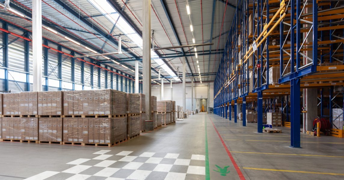 A view of full warehouse with forklift
